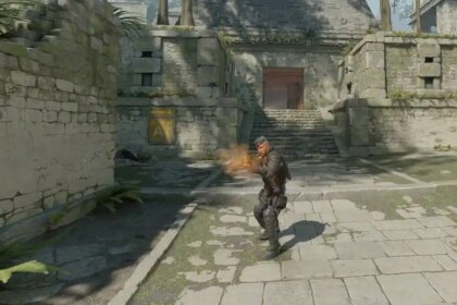 A CS2 character firing their weapon.