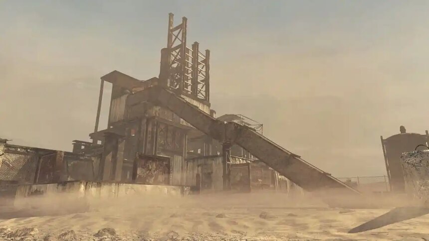 A rusted-out oil refinery covered in sand in a desert in Call of Duty: Modern Warfare 2.